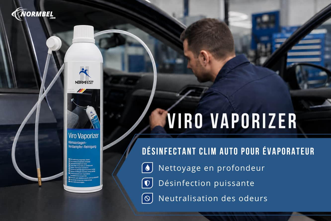 Technicien appliquant le désinfectant clim auto Normfest Viro Vaporizer sur l’évaporateur d’une voiture dans un atelier automobile.
